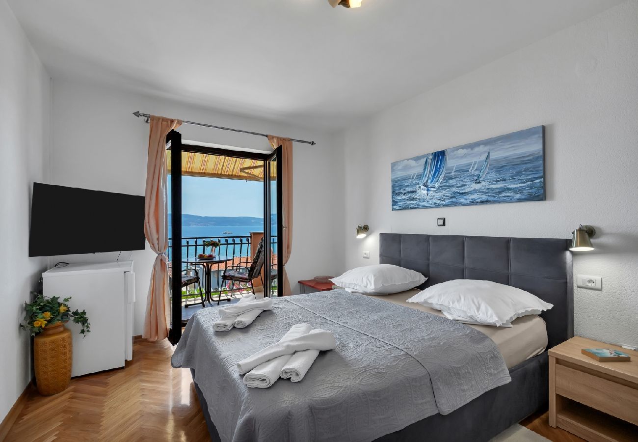 Chambres d'hôtes à Duce - Chambre dans Duće avec vue mer, Balcon, Climatisation, WIFI (79-3)