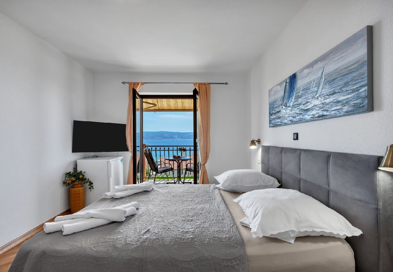 Chambres d'hôtes à Duce - Chambre dans Duće avec vue mer, Balcon, Climatisation, WIFI (79-3)