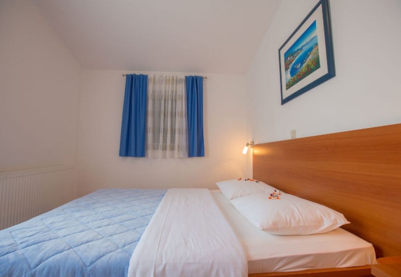 Chambres d'hôtes à Novalja - Chambre dans Novalja avec Balcon, Climatisation, WIFI (3764-2)