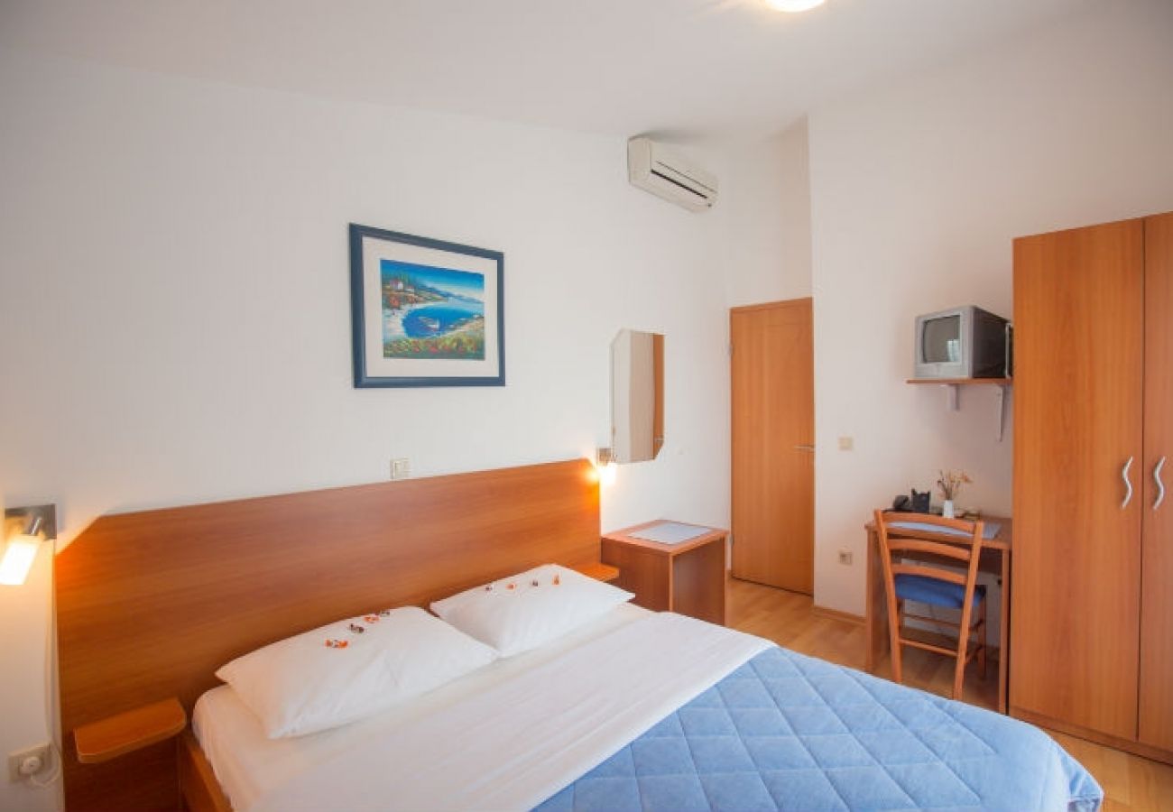 Chambres d'hôtes à Novalja - Chambre dans Novalja avec Balcon, Climatisation, WIFI (3764-2)