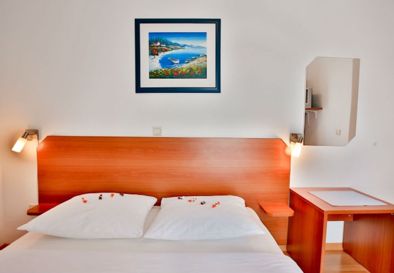 Chambres d'hôtes à Novalja - Chambre dans Novalja avec Balcon, Climatisation, WIFI (3764-2)