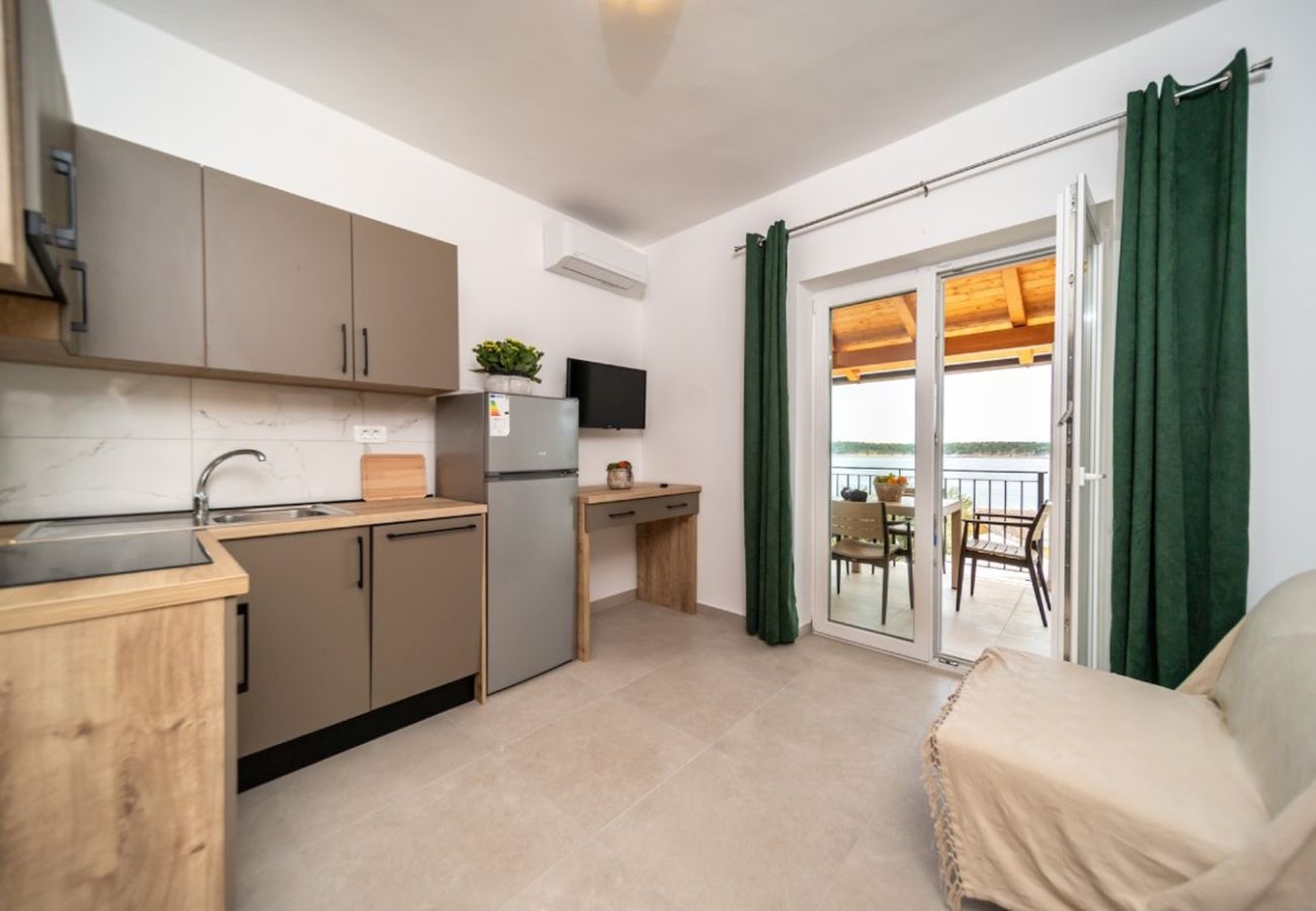 Appartement à Rab - Appartement in Barbat avec vue mer, Balcon, Climatisation (660-5)