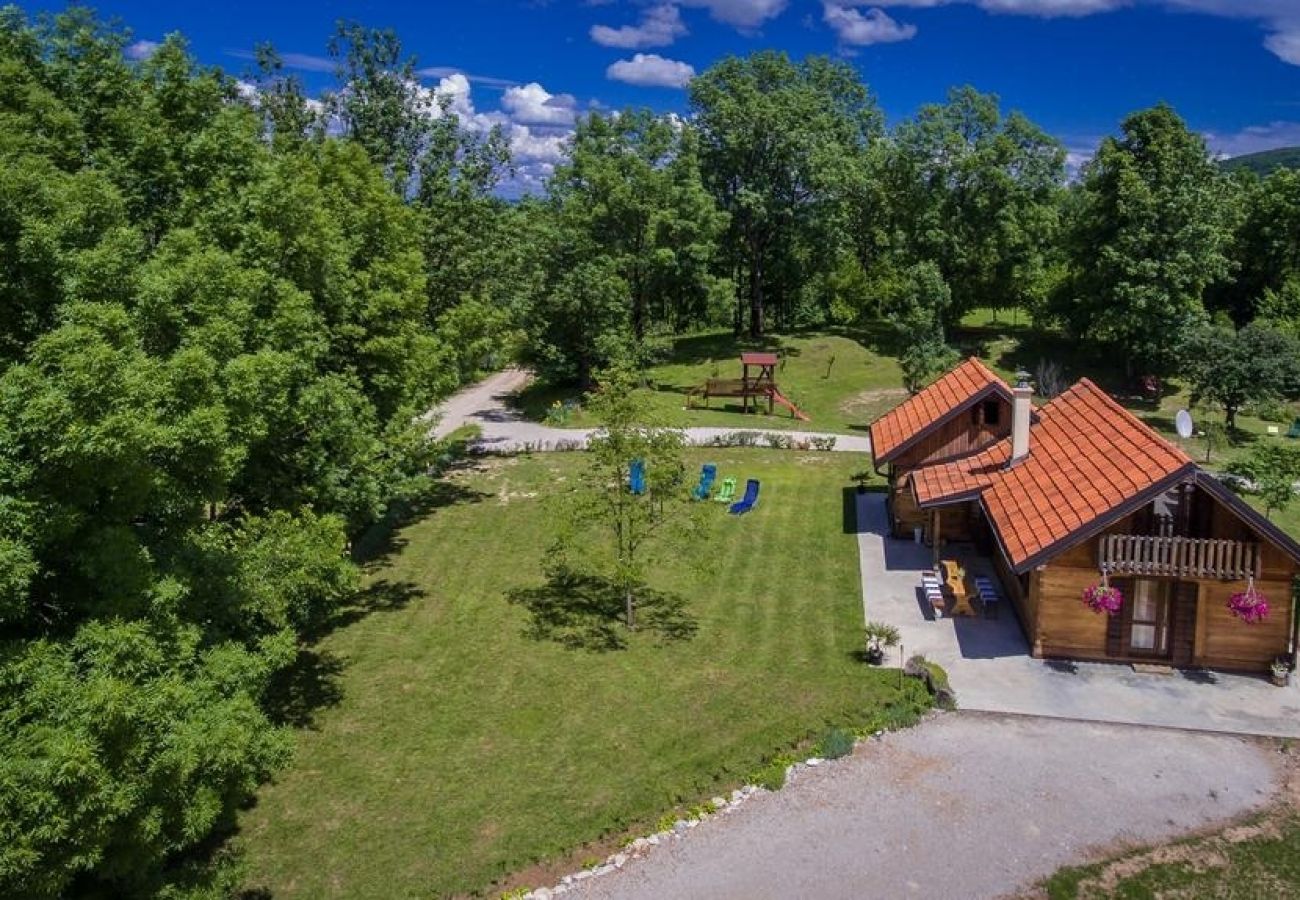 Maison à Rakovica - Maison de vacances dans Rakovica avec terrasse, WIFI, Machine à laver (4488-1)