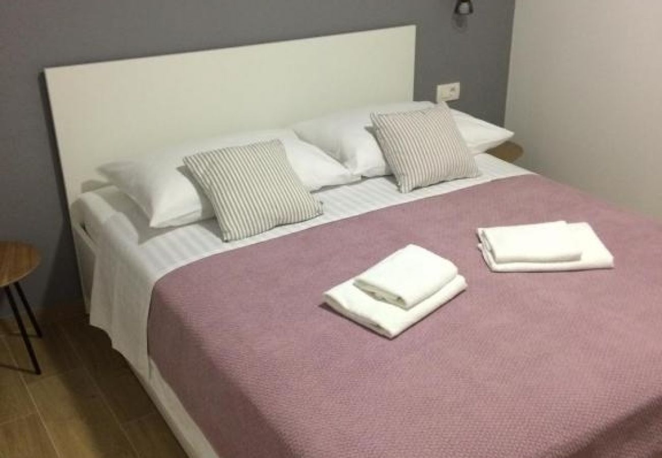 Appartement à Podgora - Appartement dans Podgora avec terrasse, Climatisation, WIFI (4492-7)