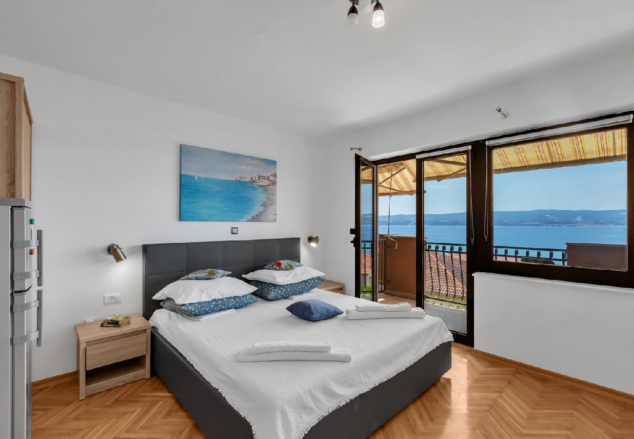 Affitto per camere a Duce - Camera in Duće con vista mare, balcone, Climatizzazione, WIFI (79-2)